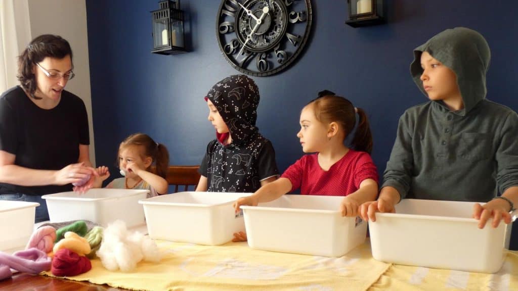 kids felting with their mother